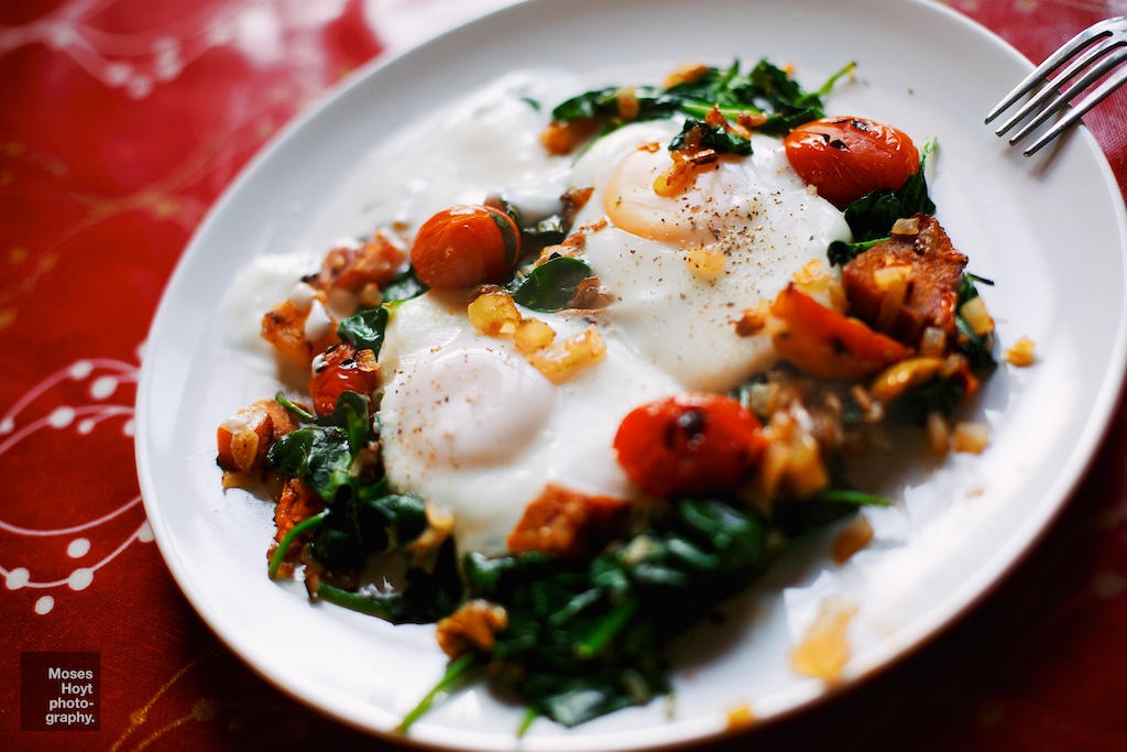 Braised eggs with spinach, roast tomatoes, sweet potato and yoghurt.